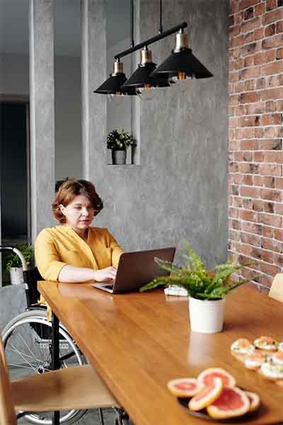 lady with laptop on online counselling session
